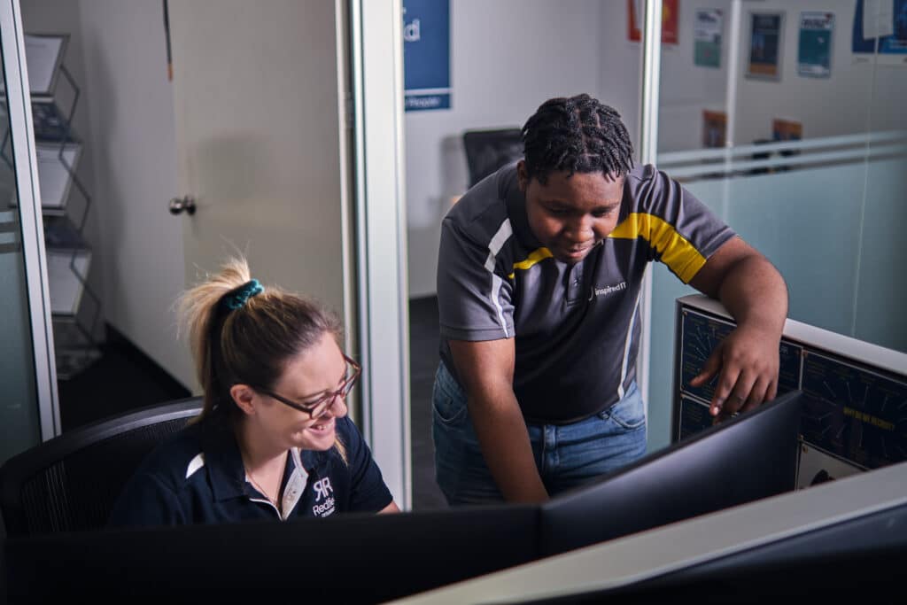 IT consultant assisting a client with their IT system.